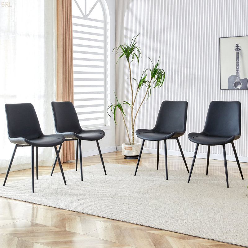 Ensemble de chaises de salle à manger en polyuréthane à coussin de siège allongé - quatre pièces. Conception aux lignes épurées. Peut s'intégrer à divers styles de décoration moderne.