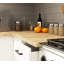 The kitchen base cabinet is white