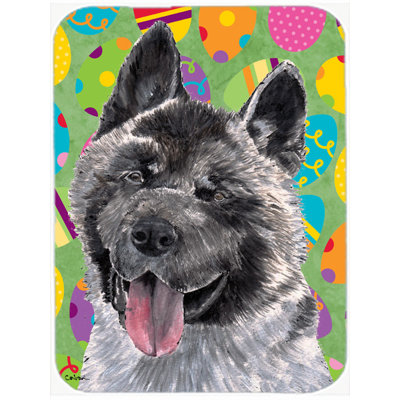 The Holiday Aisle Akita Easter Eggstravaganza Rectangle Glass Cutting Board