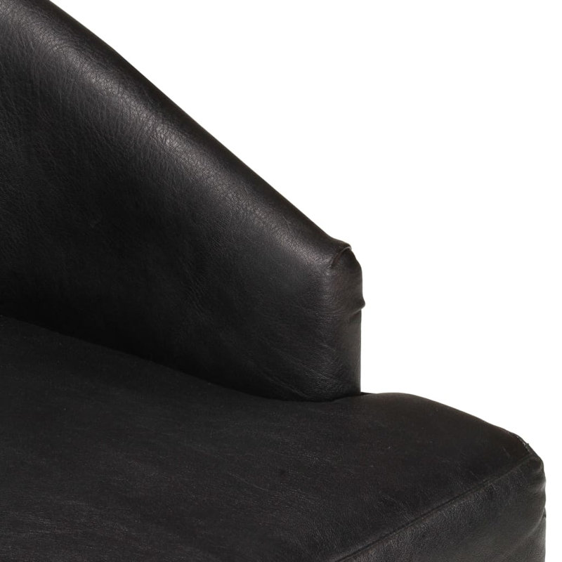 Fauteuil capitonné en cuir noir