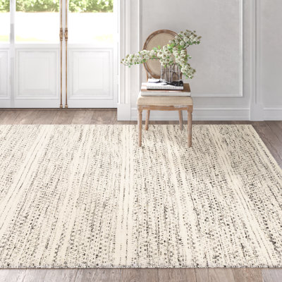 Tapis crème / noir en laine à chevrons tissés à plat