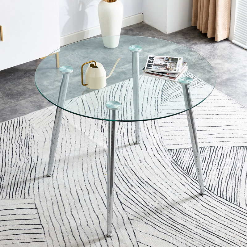Table de salle à manger circulaire avec plateau en verre et pieds en métal