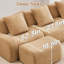 Fauteuil sans os Camel, doté d'un design ergonomique et d'accoudoirs incurvés, avec une base en tissu confortable, conçu pour le salon.