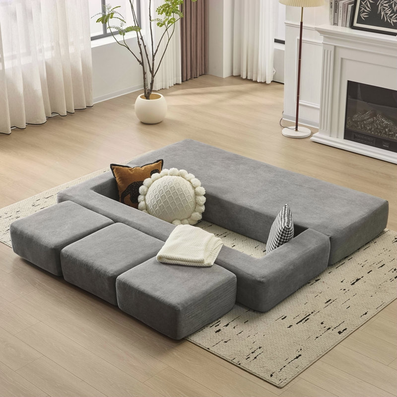 Canapé modulaire convertible avec 3 repose-pieds Ebern Designs, Gris clair