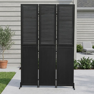 Three-panel folding room divider standing 6 feet tall; crafted from wood with a black finish; functions as a freestanding wall partition for space separation; suitable for indoor use.