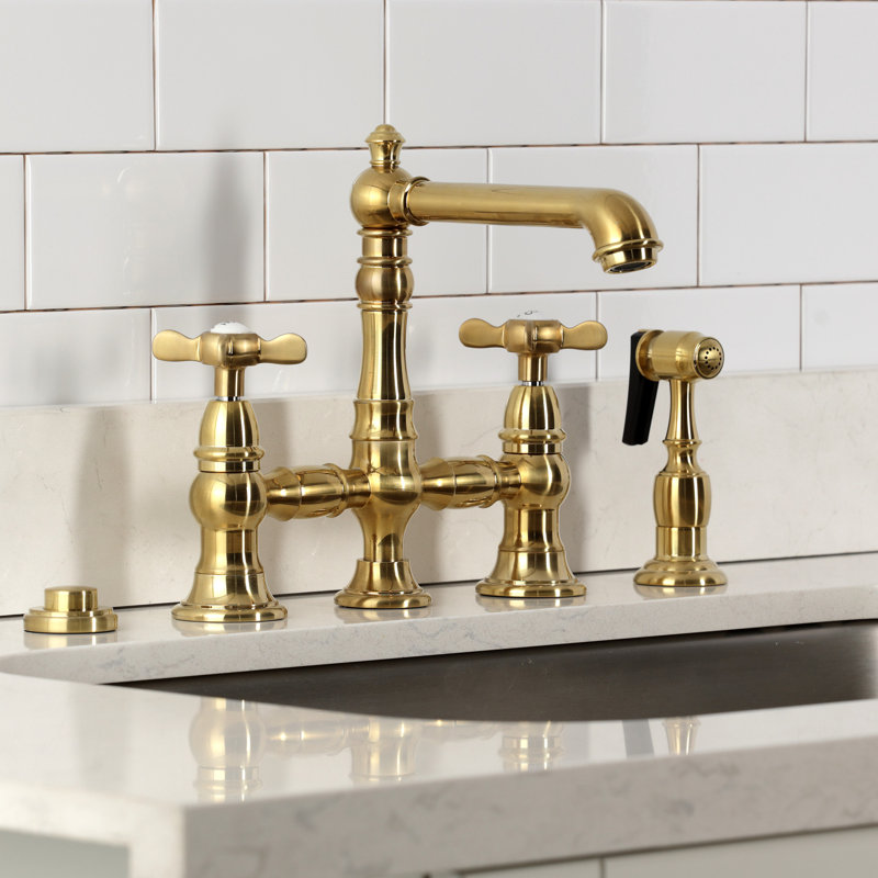 Kingston Brass Essex Two-Handle 4-Hole Deck Mount Bridge Kitchen Faucet with Brass Side Sprayer, Brushed Brass