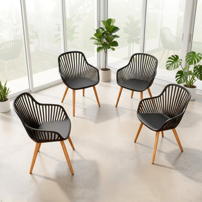 Ensemble de 4 chaises de salle à manger modernes, chaises de patio en plastique toutes saisons avec pieds en fer, chaises de cuisine ergonomiques d'une capacité de 330 lb pour une utilisation intérieure / extérieure, gris foncé