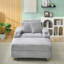 Grey corduroy single sofa with one pillow, two throw pillows, a footstool and two storage Spaces.