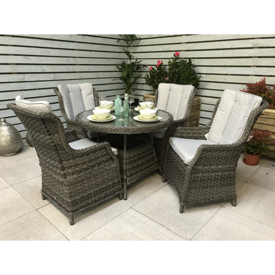 Cadmose 4 - Person Patio Dining Set Umbrella Hole Included Round Table with Cushions Included