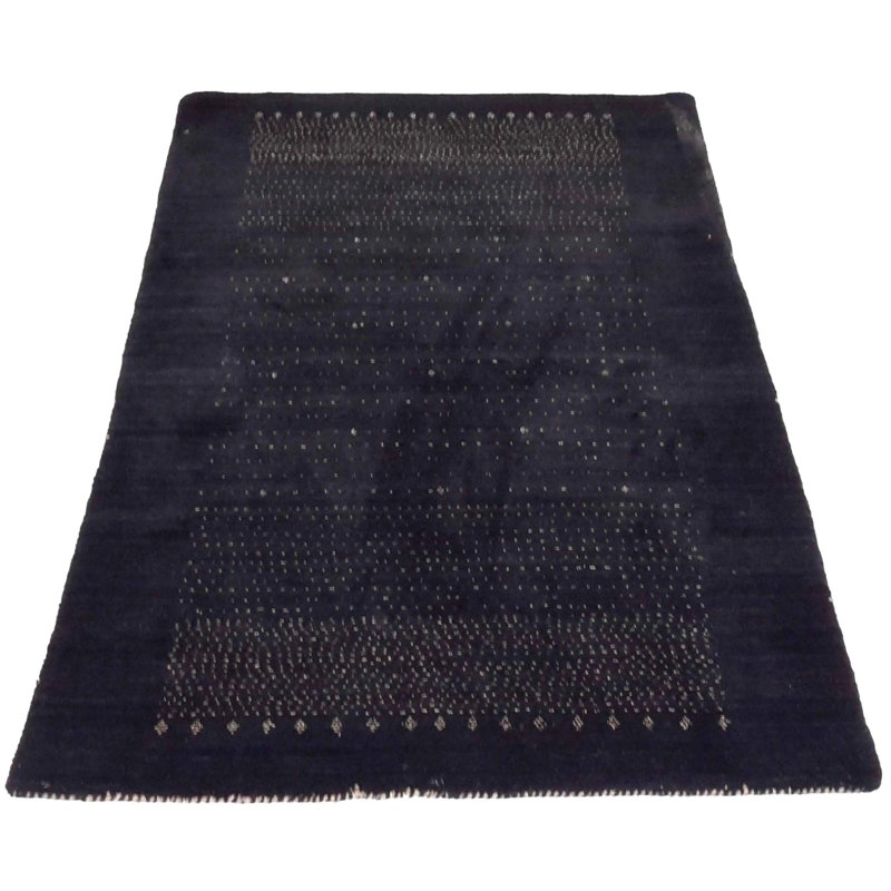 Porschea Polka Dots Area Rug in Black