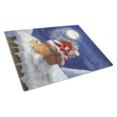 Père noël de noël de noël caroline dans la planche à découper en verre cheminée