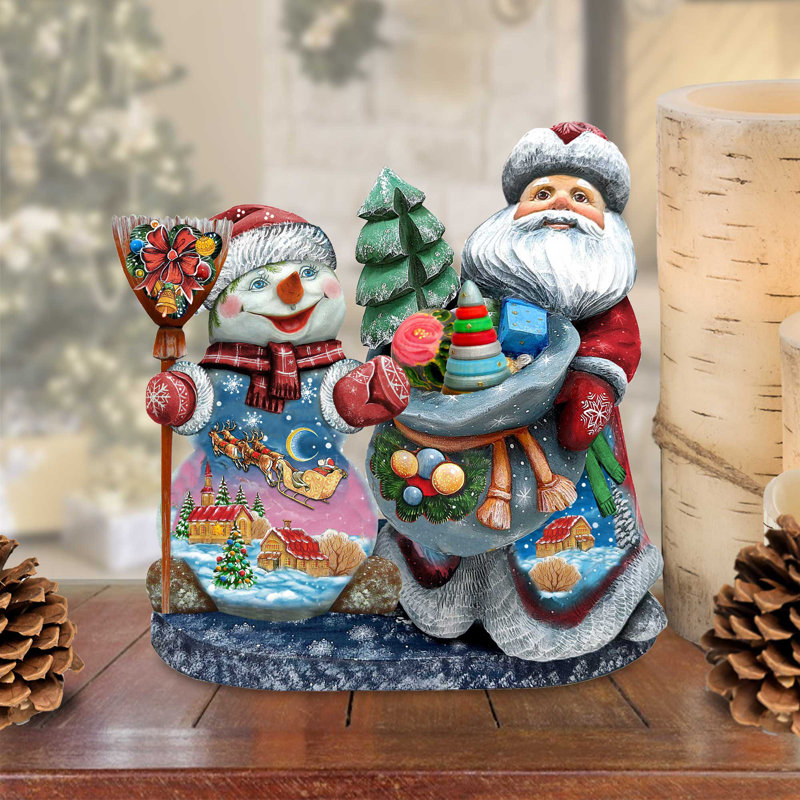 Figurine chef-d'œuvre de père Noël sculpté sur bois avec bonhomme de neige