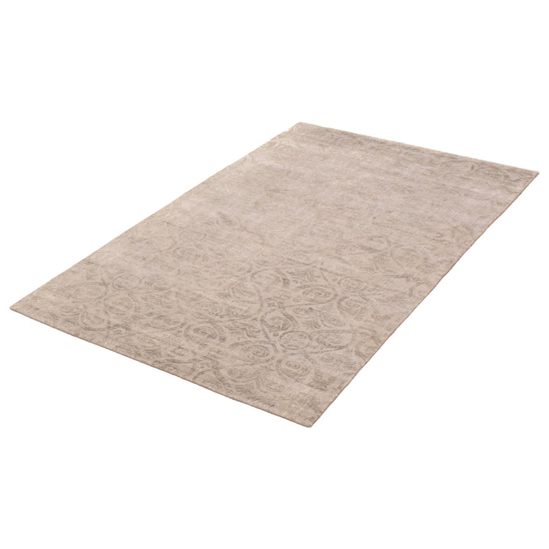 Tapis géométrique beige tissé à la main