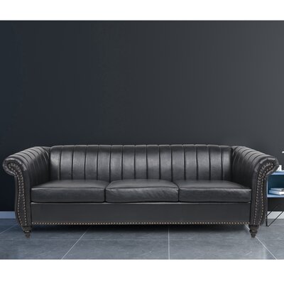 Wilcher 84'' Faux Leather Rolled Arm Chesterfield Sofa with Reversible Cushions -  Alcott Hill®, 1055F3ADFBFF4796800DB30D84900A9B