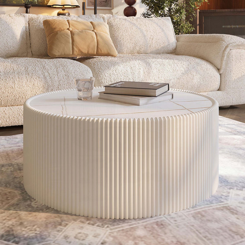 Table basse cylindrique avec plateau en pierre frittée et similicuir - texture dorée
