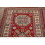 Tapis rouge à motif géométrique Kazak