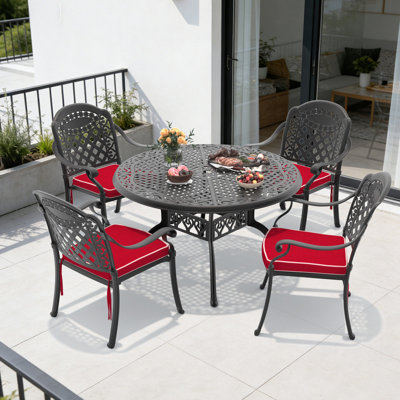 Ensemble de salle à manger de patio 5 pièces en aluminium moulé, table ronde de 48,03 po avec trou pour parasol et 4 chaises empilables avec coussins rouges