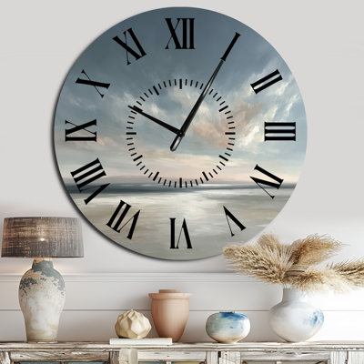 Horloge murale en métal représentant des vagues au coucher du soleil doré