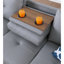 Canapé d'angle en L 3 pièces en similicuir gris, idéal pour des séances de cinéma et des jeux vidéo relaxantes. Siège central rabattable avec porte-gobelets, deux coussins décoratifs et rangement. Structure en bois massif et composite, profil bas.