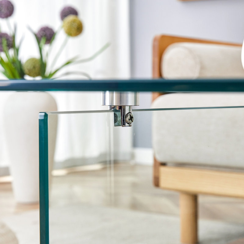Table basse carrée. Texture du bois, pieds en verre transparent. Présentoir attrayant et pratique, moderne, transparent et en bois, polyvalent
