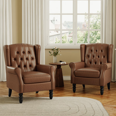 Fauteuil à oreilles capitonné avec accoudoirs roulés et coussin épais Duward