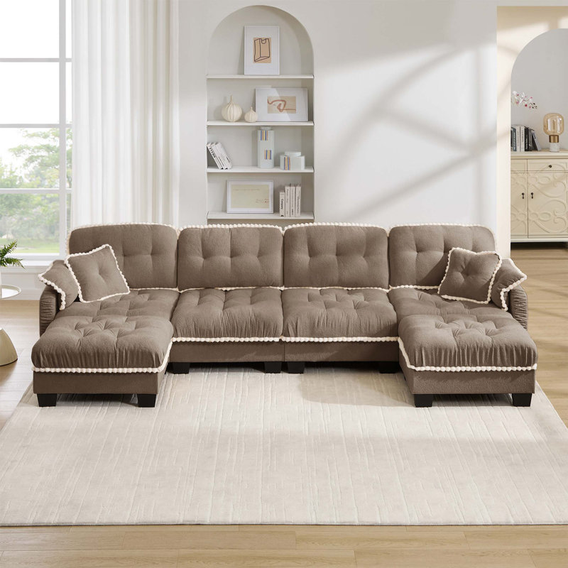 Canapé d'angle en chenille nuage avec pouf amovible et finitions à pompons