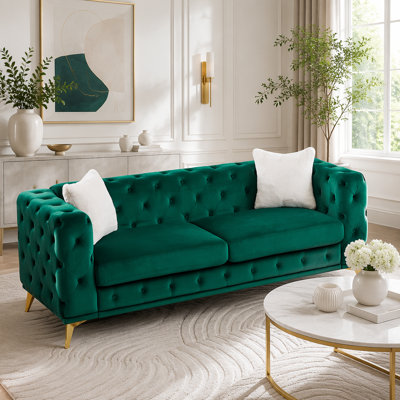 Canapé en velours de style Chesterfield avec détails capitonnés et pieds en métal