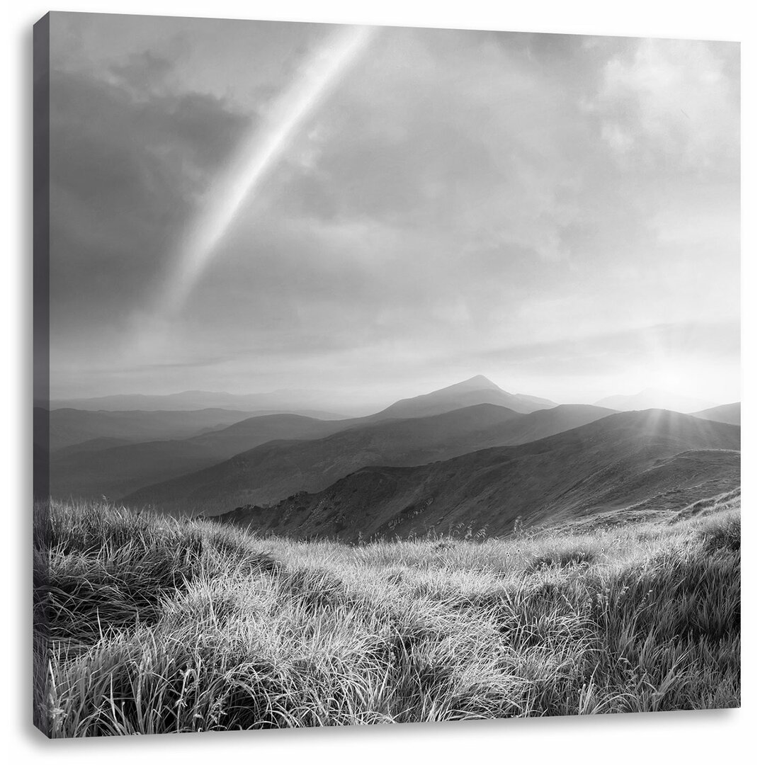 Fotodruck Schöne Berge mit einem Regenbogen am Himmel