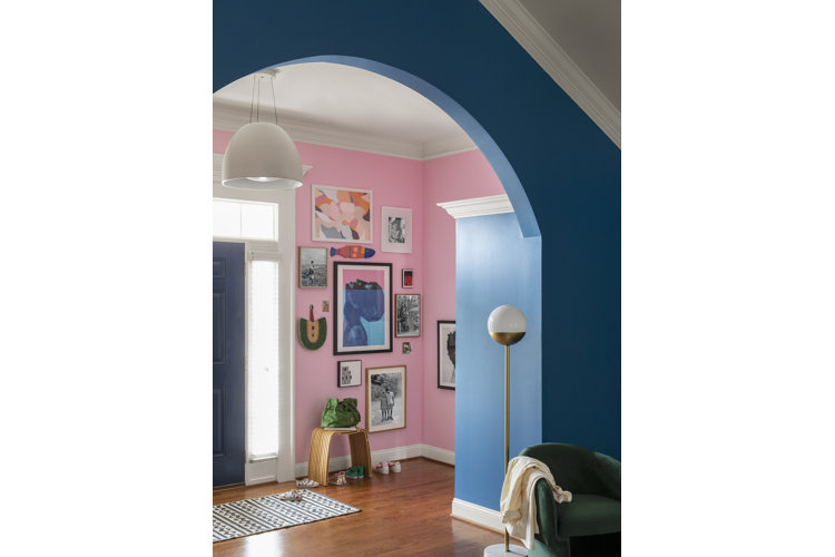 pink painted entryway with a blue painted passage
