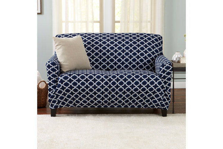 loveseat with a blue patterned slipcover