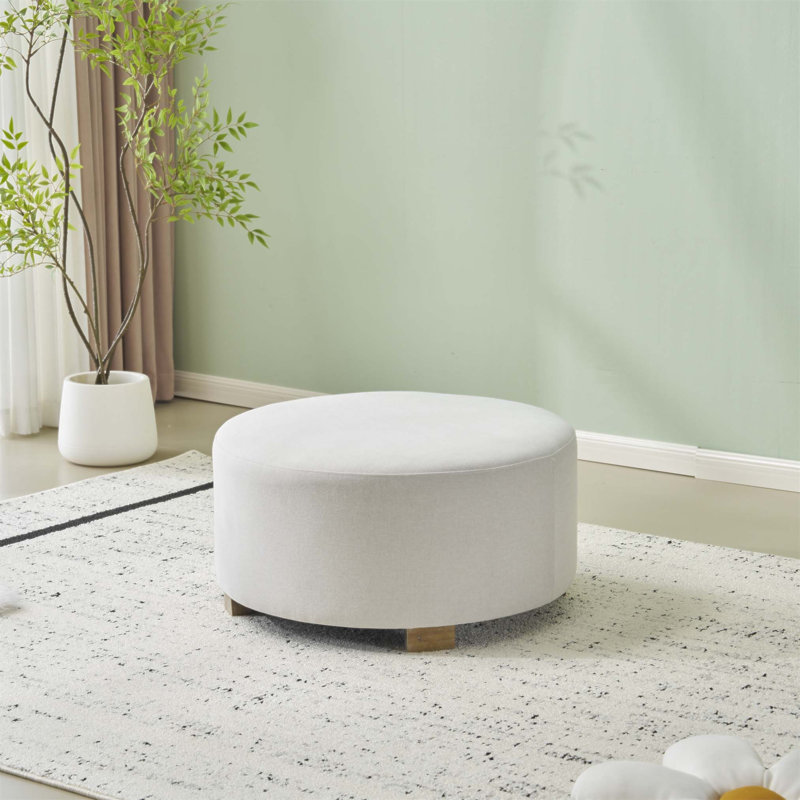 Tissu moderne blanc rond avec pieds en bois, simple et polyvalent pour un usage domestique, repose-pieds relaxant confortable