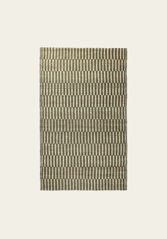 Woven area rug with green and cream striped pattern.