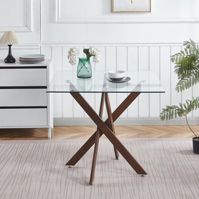 Table de salle à manger en verre trempé avec pieds croisés en métal