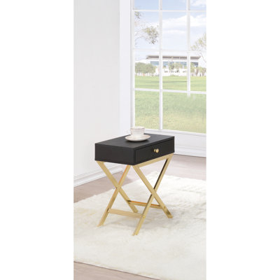 Table d'appoint à 1 tiroir avec piétement en métal fini laiton « x » et plateau rectangulaire en placage noir.