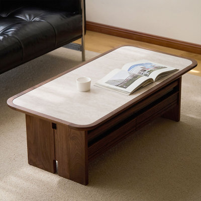 Table basse beige en pierre et bois de noyer