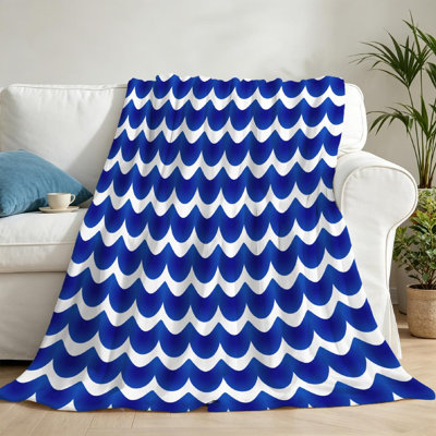 Jeté en flanelle bleue ultra douce et imprimé de vagues abstraites blanches sur une face