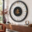 Horloge murale avec pignons en mouvement