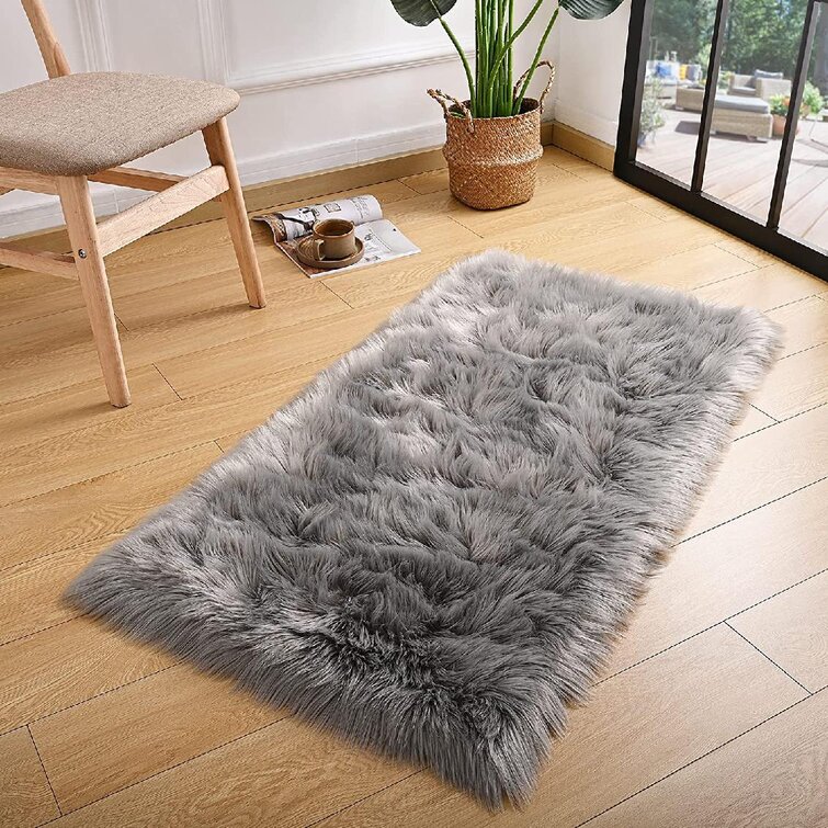 https://assets.wfcdn.com/im/31704543/resize-h755-w755%5Ecompr-r85/1802/180256233/Faux+Fur+Gray+Rug.jpg