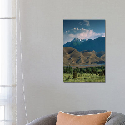 750' Sand Dunes Rise Against The Sangre De Cristo Mountains by Tim Fitzharris - Wrapped Canvas Print