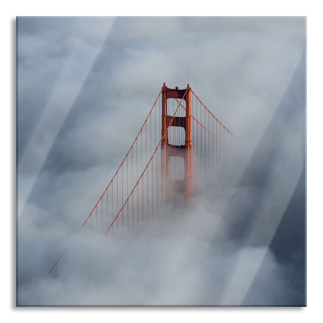 Glasbild Golden Gate Bridge über den Wolken