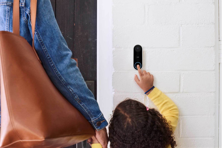 child ringing a wireless doorbell