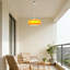 Luminaire suspendu orange à une lumière