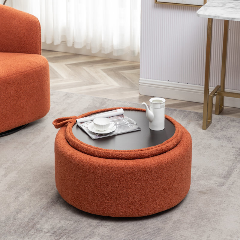Savinien Upholstered Round Storage Ottoman, Orange Performance Boucle