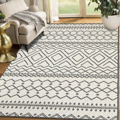 Tapis géométrique rectangulaire bleu en polypropylène tissé à la machine Brunn