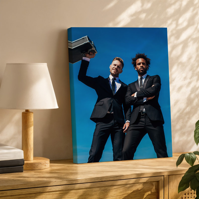 Toile «A Dramatic Low Angle Shot» mettant en vedette deux hommes vêtus habilement en costume noir, exsudant un sentiment de confiance et d'intensité, art mural