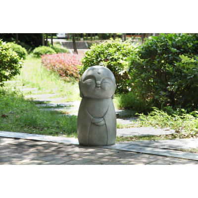 Statue Jizo japonais heureux souriant