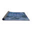 Tapis bleu-905834804