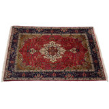 Pirley Oriental Area Rug in Red