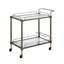 Chariot de service Sanda avec tablettes en verre et finition laiton antique