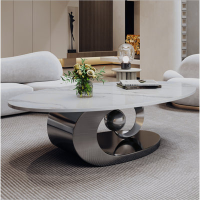 Table basse en marbre avec base sculpturale en acier inoxydable